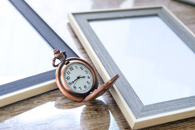 Low angle view of clock on table