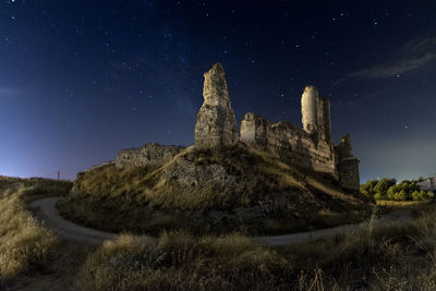 Old building against sky at night