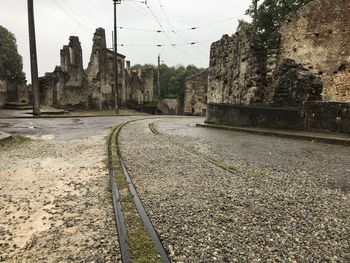 Surface level of railroad tracks against sky