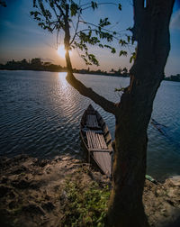 Scenic view of lake against sky during sunset