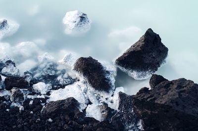 Panoramic view of frozen rocks against sky