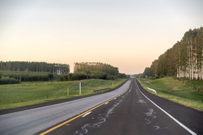 Empty road against clear sky