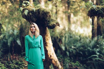 Portrait of young woman in forest