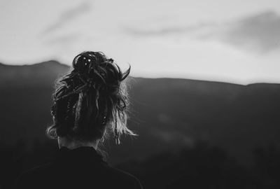 Rear view of woman looking at mountain