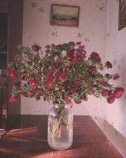 Flower vase on table at home