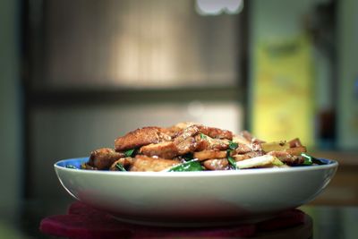 Close-up of meat in bowl on table