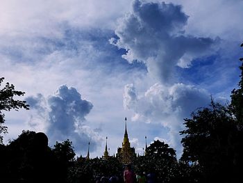 Low angle view of building against cloudy sky