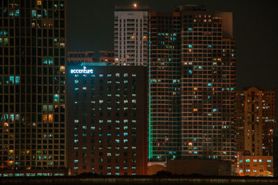 Illuminated buildings in city at night