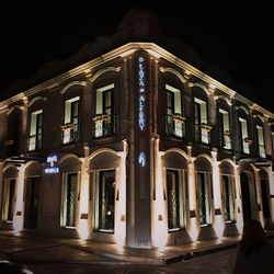 Low angle view of illuminated building at night