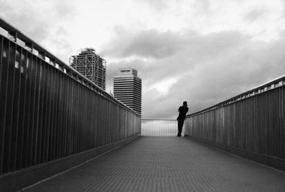 Low angle view of people walking on road