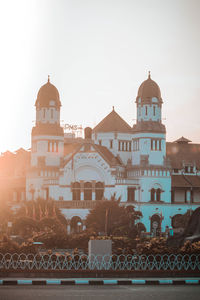 View of buildings in city against sky