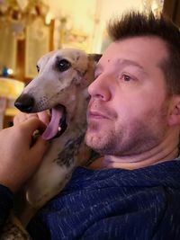 Portrait of young man with dog