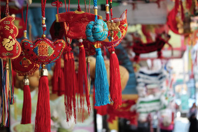 Close-up of chinese decoration hanging for sale at market stall 