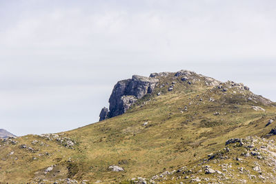 Rock formations on mountain against sky