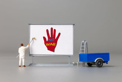 Rear view of woman with text on wall