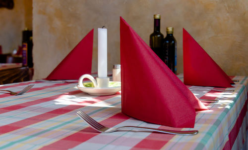 Place setting on table in restaurant