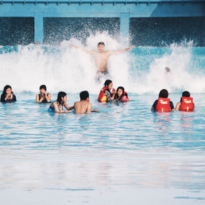 People enjoying in swimming pool