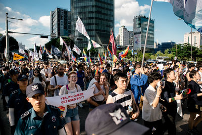 People standing on street in city