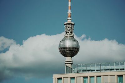 Low angle view of fernsehturm tower against sky