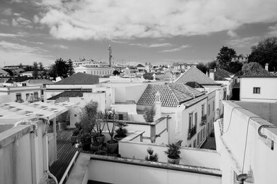 High angle view of buildings in city against sky