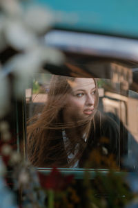 Portrait of young woman looking away