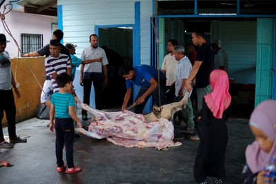 Group of people standing in front of building