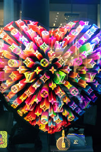 Close-up of multi colored umbrellas hanging at store