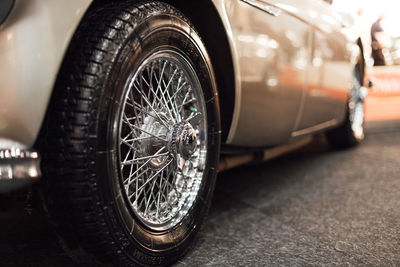 Close-up of vintage car, aston martin db5 with chrome wire wheels