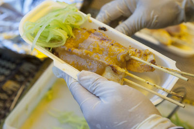 Close-up of hand holding food