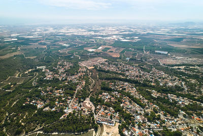 High angle view of city buildings against sky