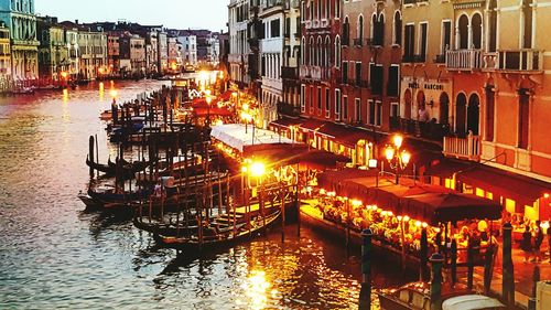 Boats in canal with buildings in background