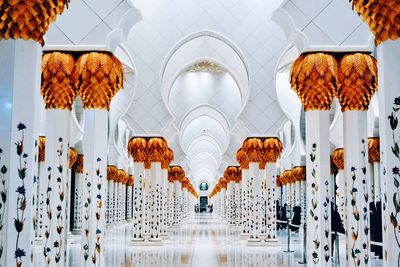 Low angle view of illuminated lanterns hanging on ceiling in building