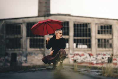 Woman with umbrella in rain