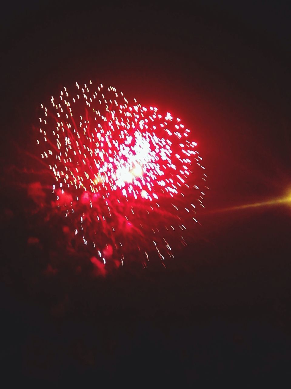 night, celebration, exploding, illuminated, firework display, glowing, red, firework - man made object, low angle view, long exposure, arts culture and entertainment, motion, event, sparks, firework, sky, fire - natural phenomenon, dark, celebration event, entertainment