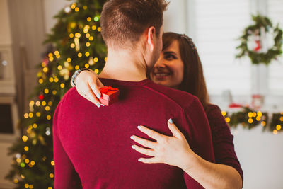 Couple kissing in christmas tree
