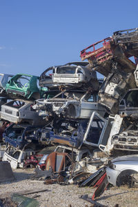 High angle view of abandoned car against sky