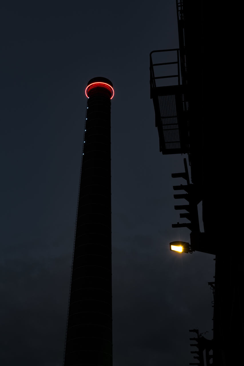 LOW ANGLE VIEW OF ILLUMINATED BUILDING AGAINST SKY