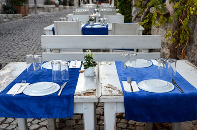 Empty chairs and table at restaurant