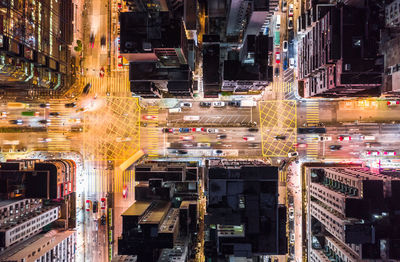 High angle view of illuminated city buildings at night