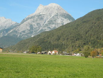 Scenic view of landscape and mountains against sky