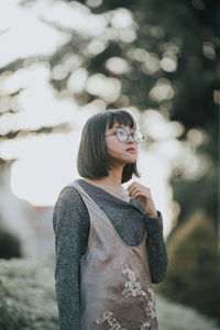 Thoughtful young woman looking away