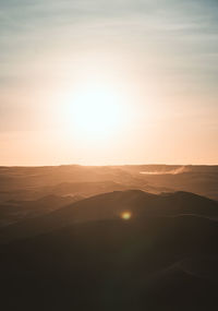 Scenic view of silhouette mountain against sky during sunset