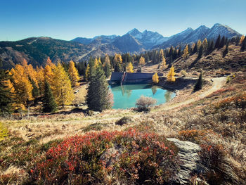Scenic view of lake against sky during autumn