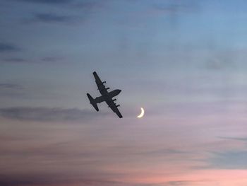 Low angle view of airplane in sky