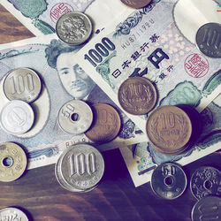 High angle view of coins on table