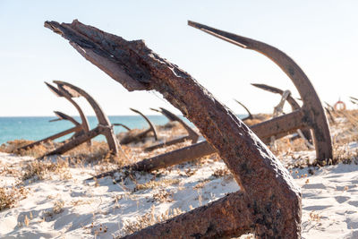 Close-up of rusty metal against sky