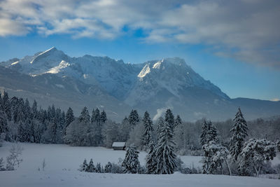 Scenic view of snowcapped mountains against sky