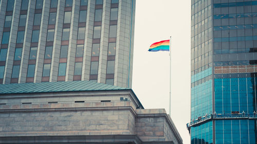 Low angle view of flag in city