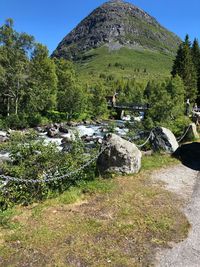 Scenic view of waterfall against sky