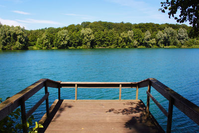 Pier over lake against sky